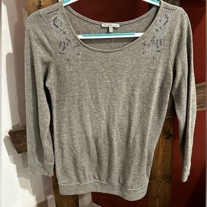 Gray sweater with beaded design near shoulders. Size small